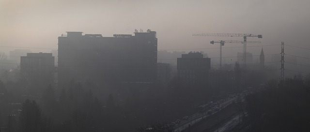 Urban skyline shrouded in dense smog, emphasizing the impact of air pollution on city environments and the urgency for cleaner solutions.